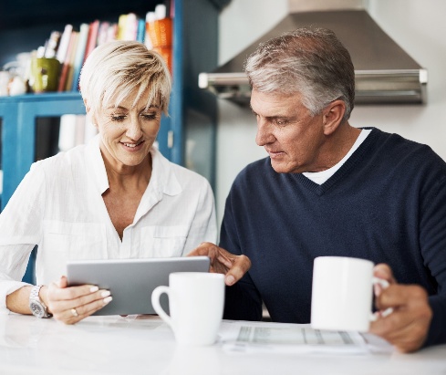 Two people reviewing their financial plan together at home